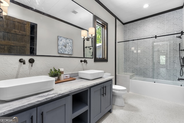 full bathroom with vanity, toilet, tiled shower / bath combo, and ornamental molding