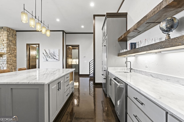 kitchen with light stone counters, dishwasher, sink, gray cabinets, and a center island