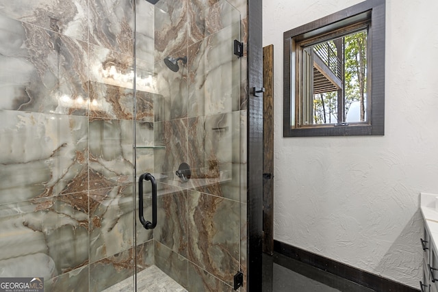 bathroom with vanity and a shower with shower door