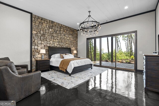 bedroom featuring a stone fireplace, crown molding, access to exterior, and a chandelier