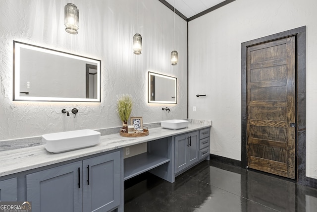 bathroom with vanity, ornamental molding, and concrete flooring