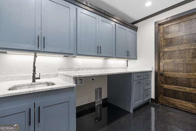 laundry area with sink, electric dryer hookup, ornamental molding, and cabinets