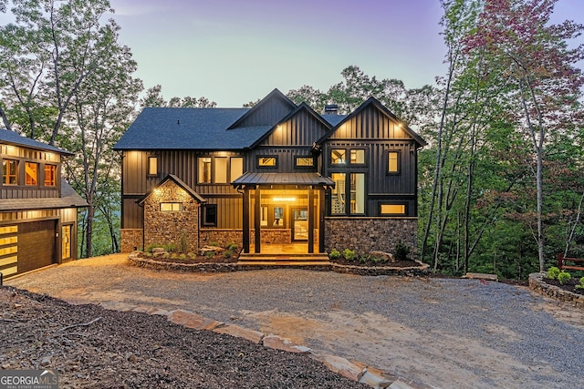 view of front of home with a porch and a garage