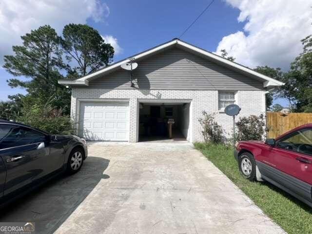 view of property exterior featuring a garage