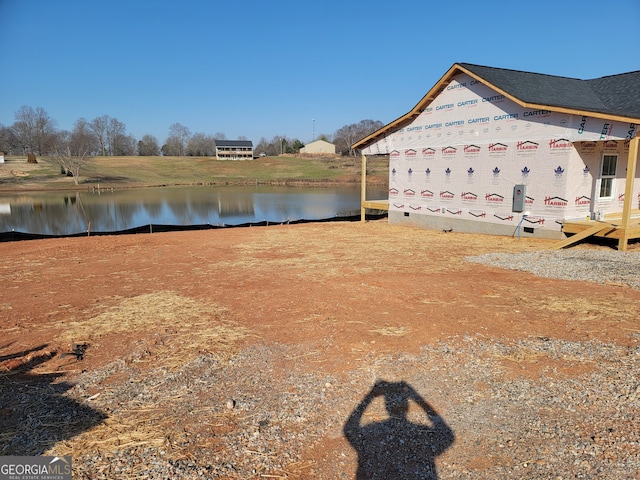 view of home's exterior with a water view