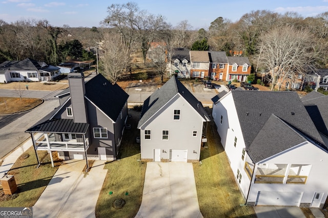 birds eye view of property with a residential view