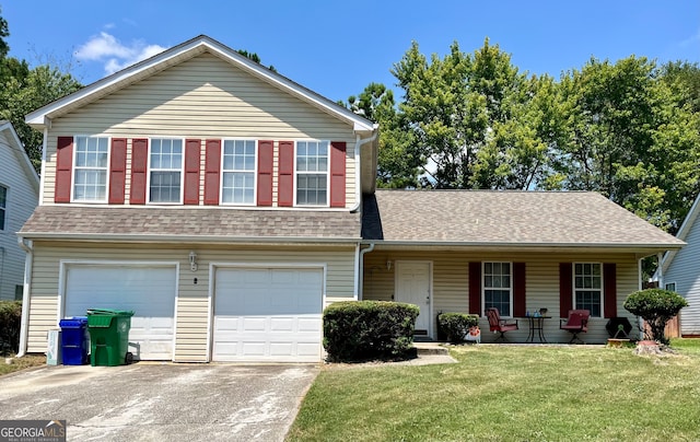 view of front facade with a porch, a garage, and a front lawn