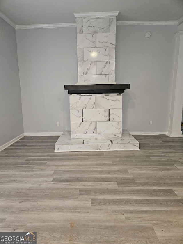 interior space with wood-type flooring and ornamental molding