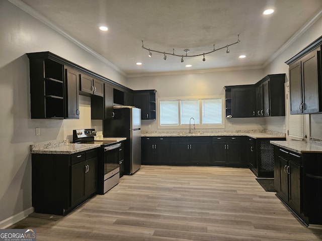 kitchen featuring light hardwood / wood-style flooring, light stone countertops, range with electric cooktop, and rail lighting