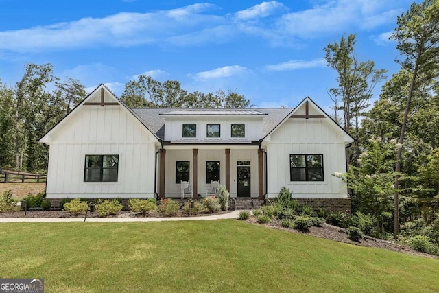 modern inspired farmhouse with a front yard