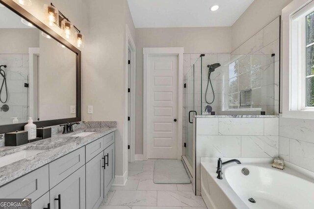 bathroom with tile patterned floors, shower with separate bathtub, and double vanity