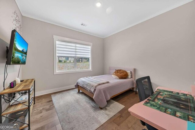 bedroom with wood-type flooring