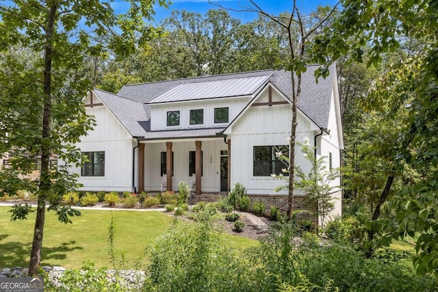 modern farmhouse with a front yard