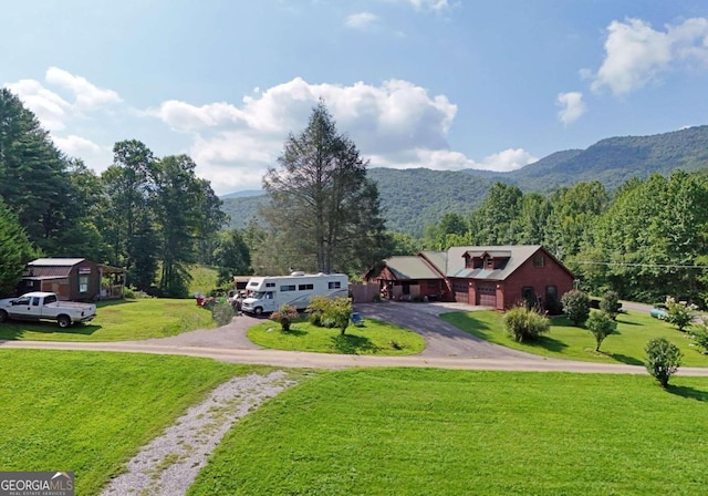 exterior space with a yard and a mountain view