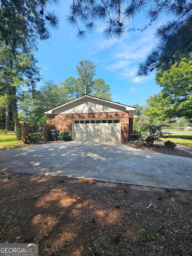 view of side of property featuring a garage