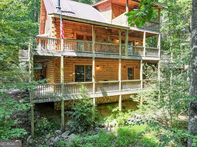 view of side of home with a balcony