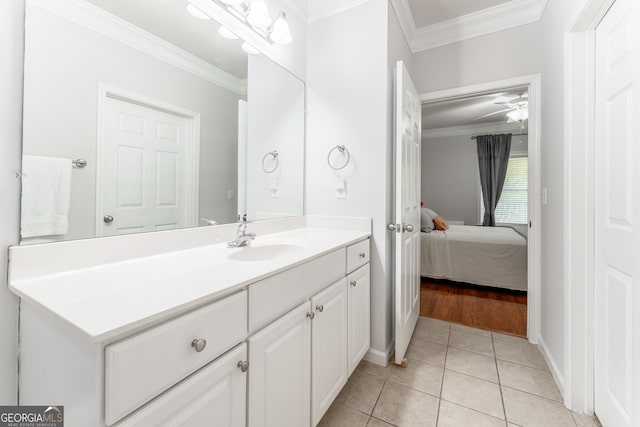 bathroom featuring ornamental molding, tile patterned flooring, vanity, and ceiling fan