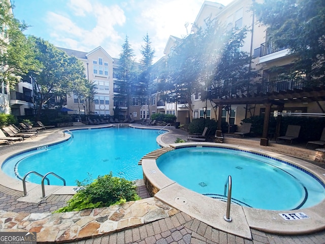 view of swimming pool with a patio area