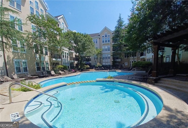 view of swimming pool with a patio