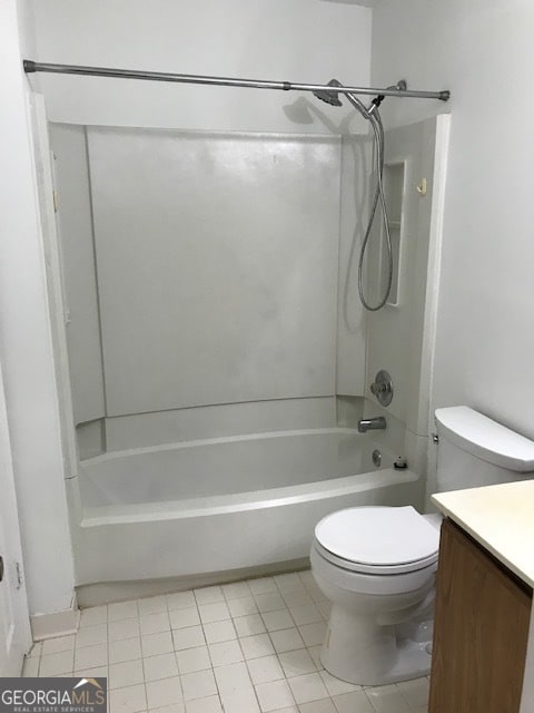 full bathroom with toilet, tile patterned floors, vanity, and bathing tub / shower combination