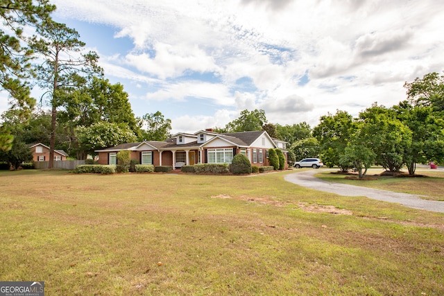 ranch-style home with a front yard