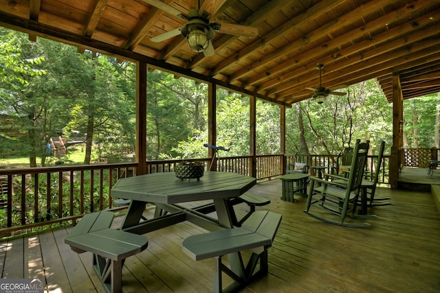 wooden deck featuring ceiling fan