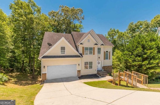 view of front of home with driveway and brick siding