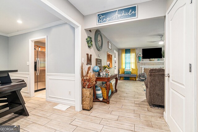 hallway featuring crown molding