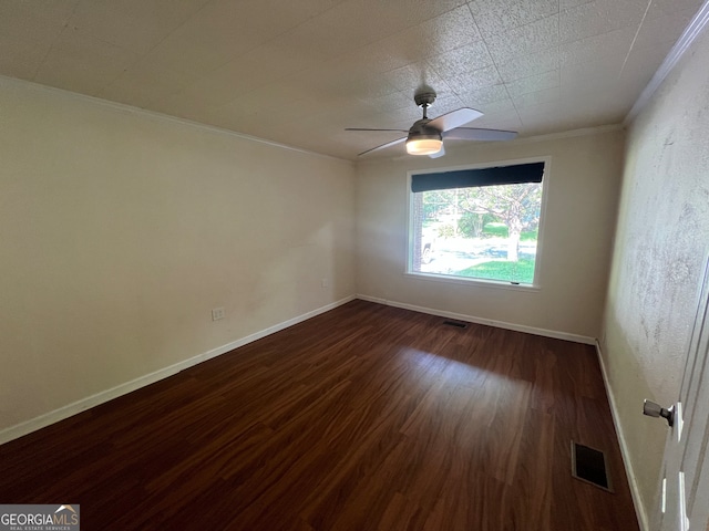 spare room featuring ceiling fan, wood-type flooring, and ornamental molding