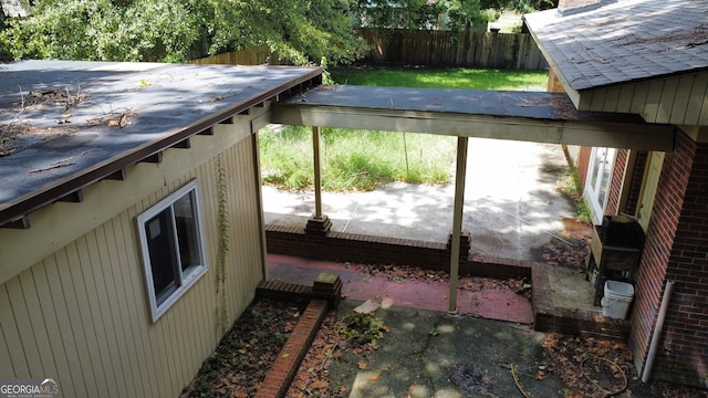 view of side of home with a patio area