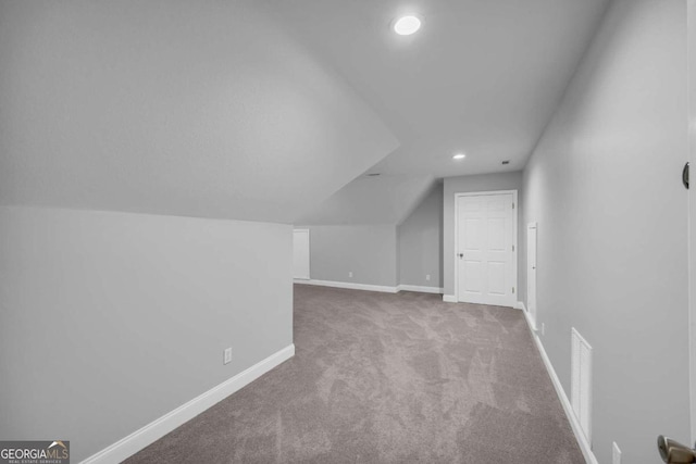 bonus room featuring carpet floors, recessed lighting, visible vents, vaulted ceiling, and baseboards