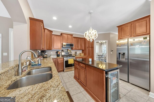 kitchen featuring wine cooler, sink, an inviting chandelier, dark stone countertops, and stainless steel appliances