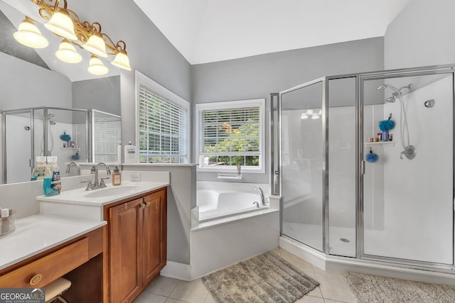 bathroom featuring tile patterned floors, separate shower and tub, and vanity