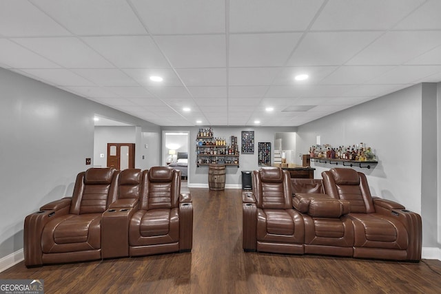 home theater featuring bar and dark hardwood / wood-style floors