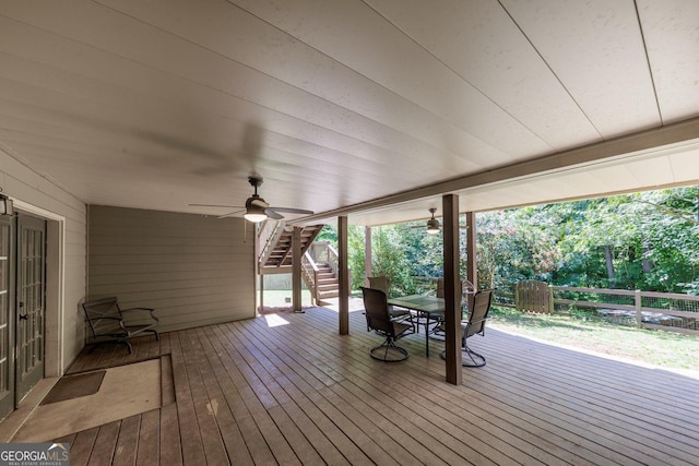 wooden deck featuring ceiling fan