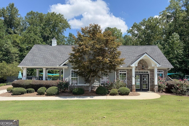 craftsman house featuring a front yard