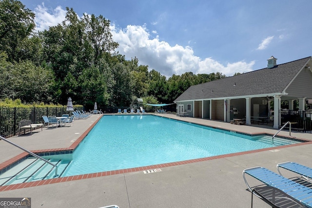 view of swimming pool with a patio area