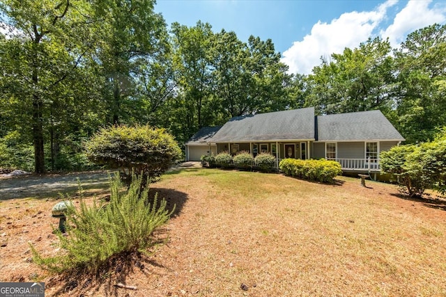 back of house with a yard and a wooden deck