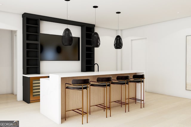 bar featuring light wood-style flooring and pendant lighting