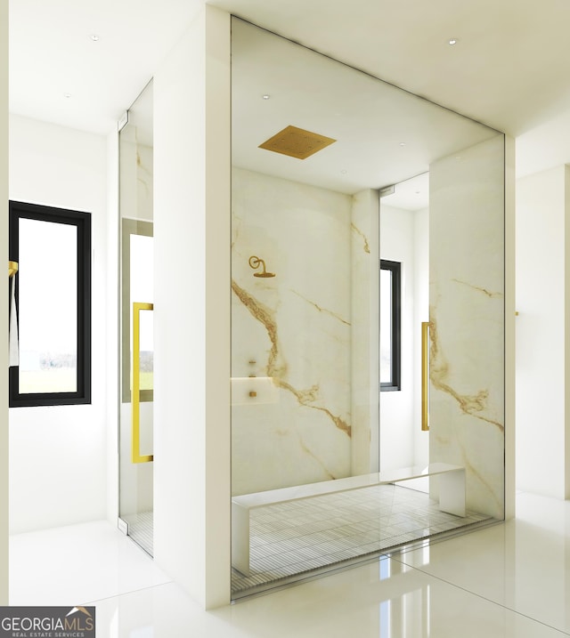 bathroom featuring a marble finish shower