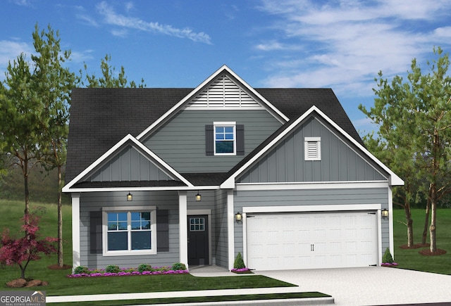 view of front facade with a front yard and a garage