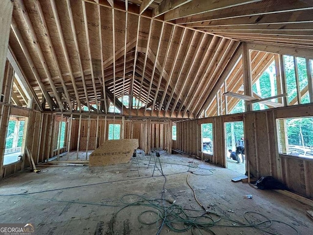 misc room with high vaulted ceiling and plenty of natural light