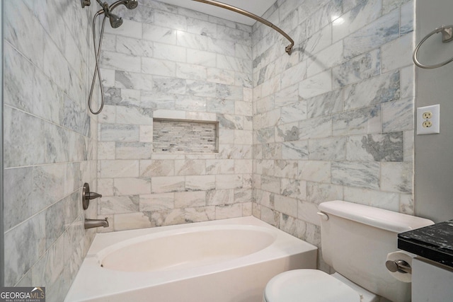 full bathroom with vanity, toilet, and tiled shower / bath combo