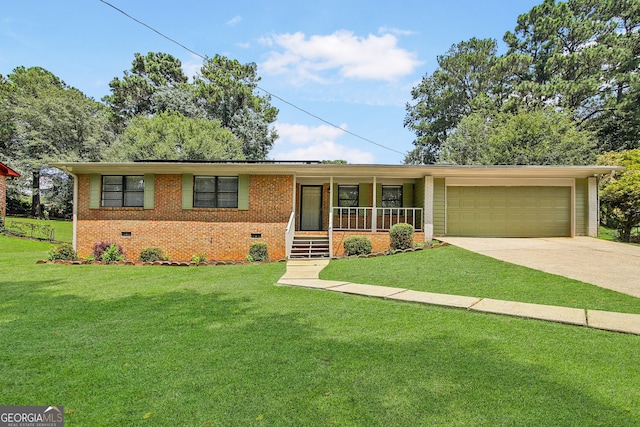 ranch-style home with a front lawn, covered porch, and a garage