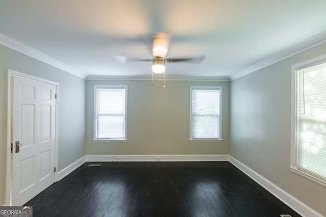 spare room featuring crown molding, dark hardwood / wood-style flooring, and ceiling fan