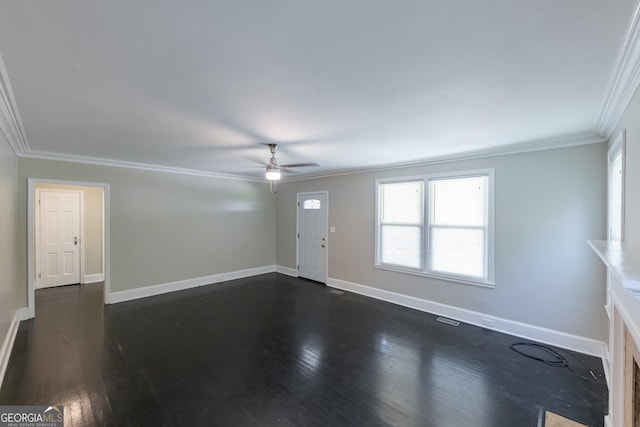 unfurnished living room featuring a ceiling fan, dark wood-style flooring, baseboards, and ornamental molding