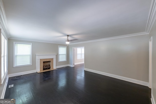unfurnished living room featuring dark wood-style floors, baseboards, ornamental molding, and ceiling fan