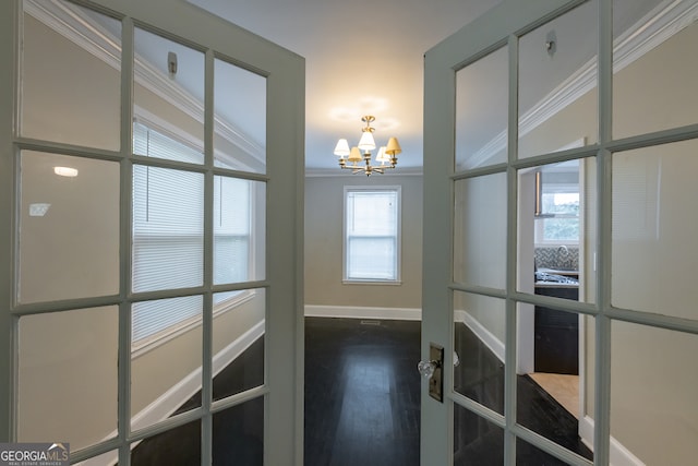 hallway with lofted ceiling, crown molding, a notable chandelier, and wood-type flooring