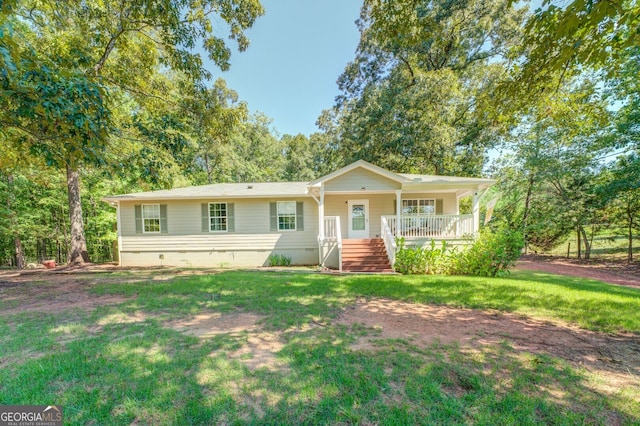 ranch-style house featuring a front yard