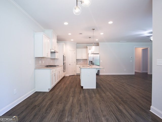 kitchen with tasteful backsplash, an island with sink, light stone counters, sink, and dark wood-type flooring